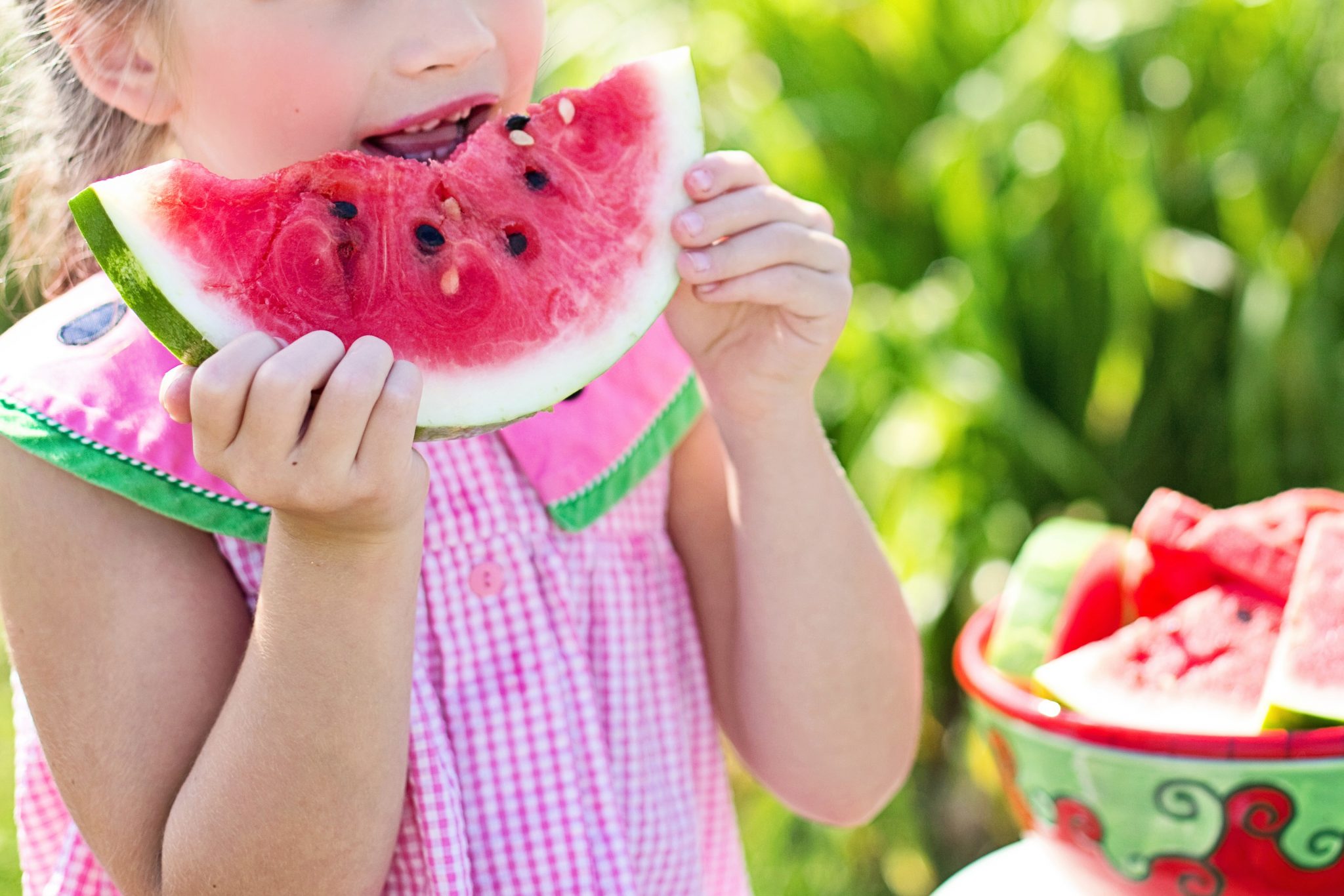 Canva - Little Girl Eating Watermelon