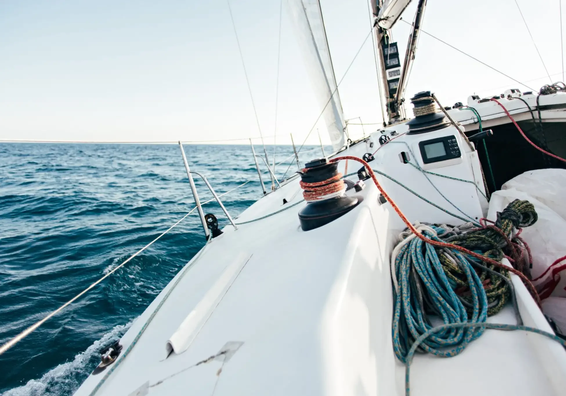 deck-professional-sailboat-racing-yacht-competition-sunny-windy-summer-day-moving-fast-through-waves-water-with-spinnaker-up