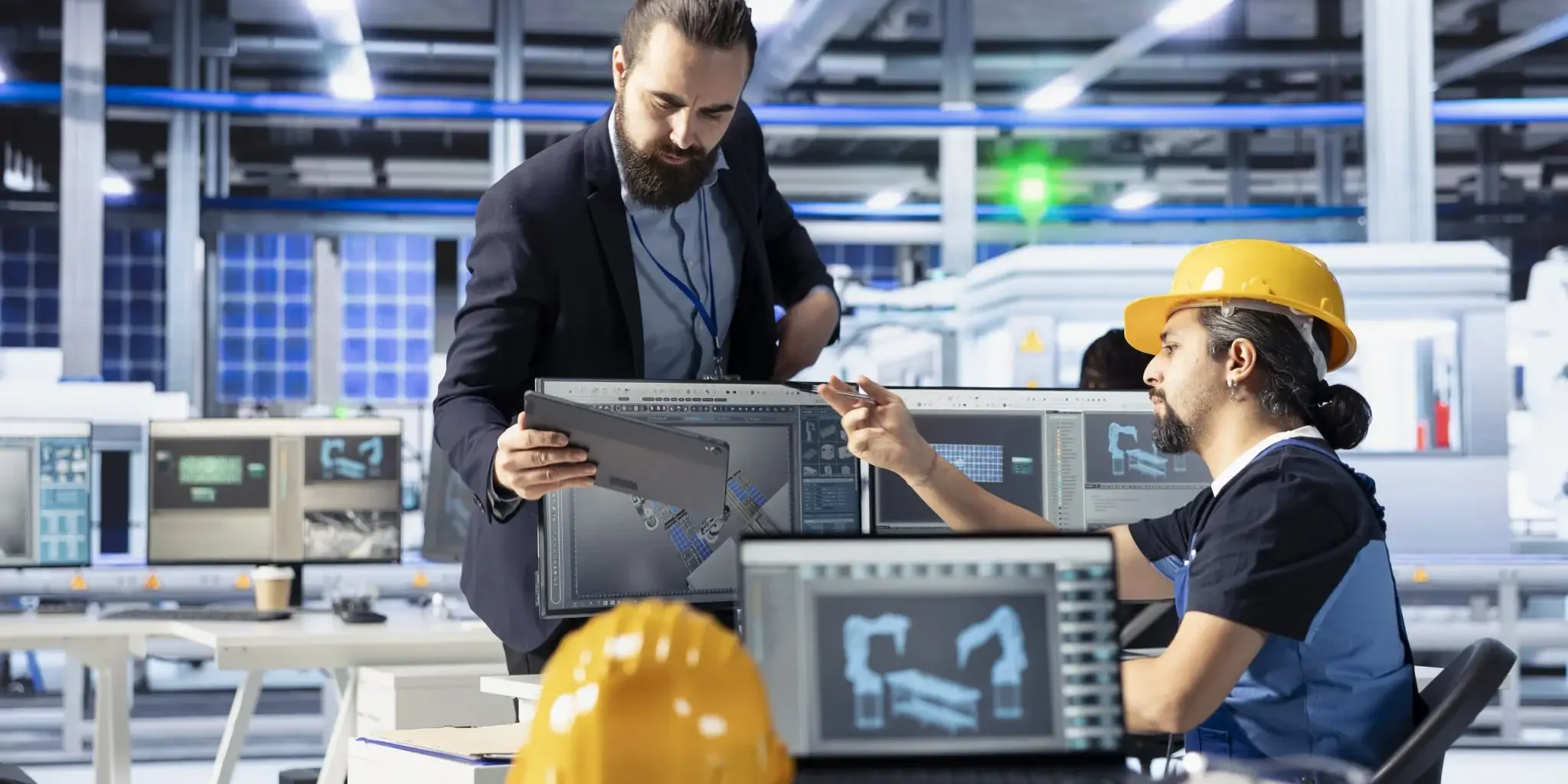 photovoltaics-factory-manager-using-tablet-monitor-manufacturing-process